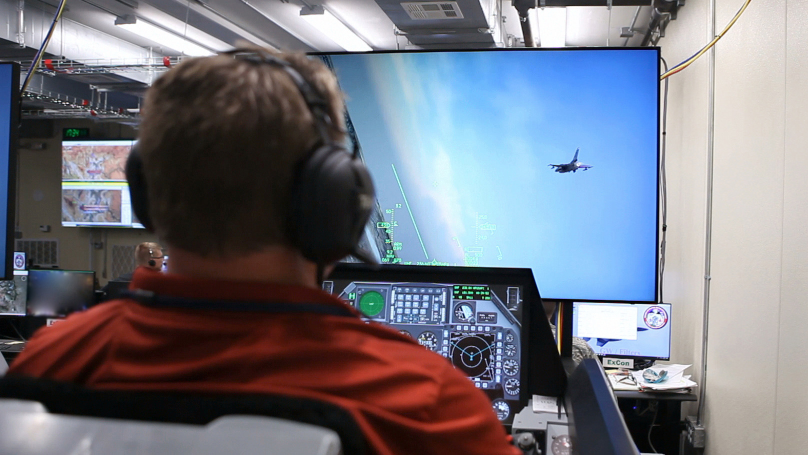 Donald Simones at AFRL’s 711th Human Performance Wing, flies the simulated F-16 in a Deployable Tactical Trainer with the virtual scene rendered in VRSG during the SLATE demonstration at Nellis Air Force Base, September 2018. (U.S. Air Force photo.)