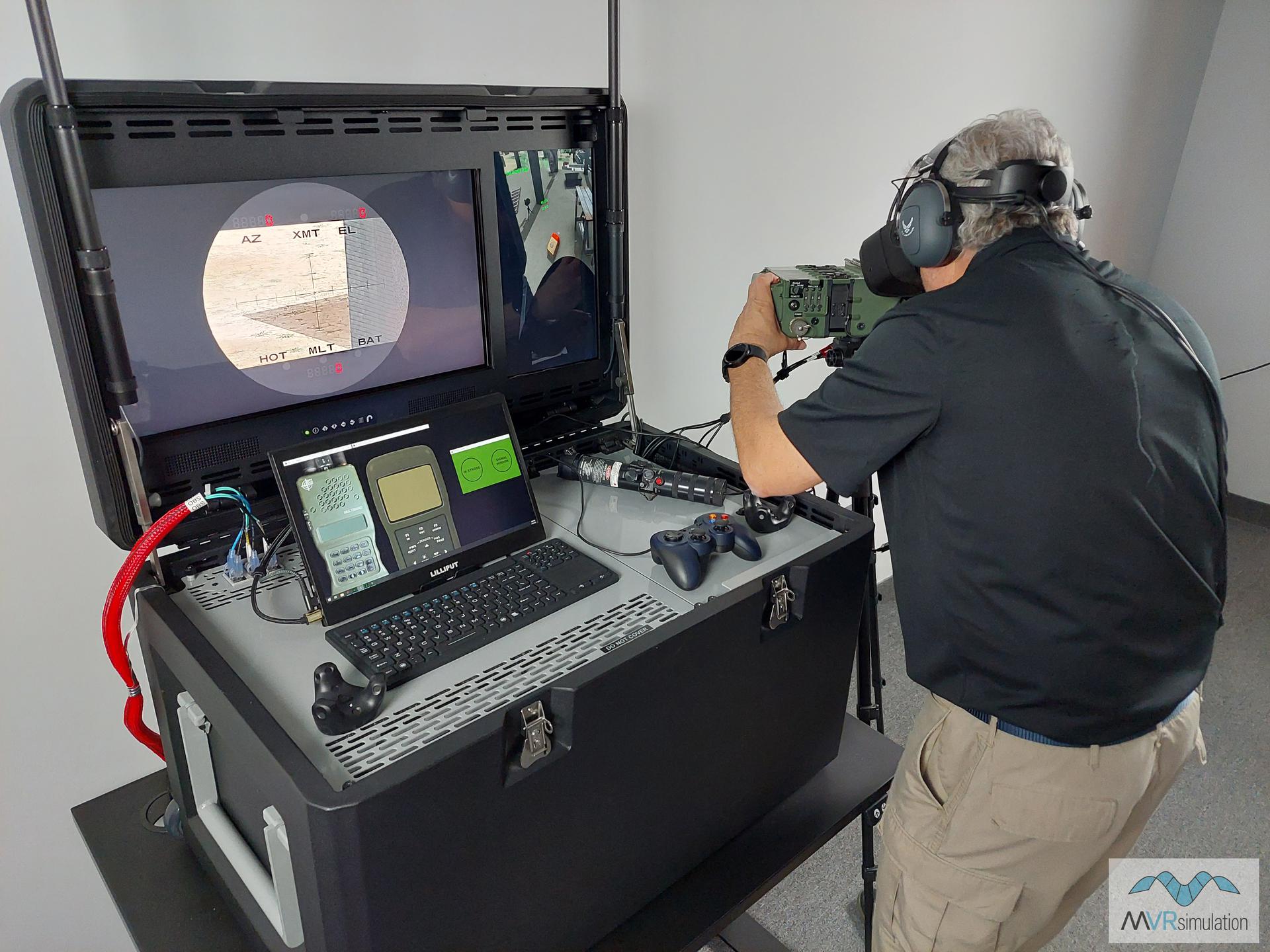 At MVRsimulation's DJFT Observer station, looking through the Varjo XR-3 headset at the VRSG scene displayed in the emulated SOFLAM; with simulated PRC-152 radio and Advanced GPS Receiver (C-EAGR).